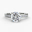 Round diamond engagement ring with side diamonds on the shank in the white gold a white background