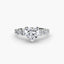 Diamond ring with a heart-shaped center stone round side stones on a white background