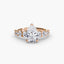 Rose gold diamond ring with a pear-shaped center stone on a white background