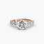 Rose gold ring with a large round diamond and smaller diamonds on the sides against a white background