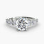 Round diamond ring with side stones white gold on a white background