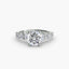 Round diamond ring with a small round diamonds on the band on a white background