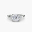 Diamond ring with asscher-cut center stone baguette on the side on a white background