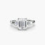 Diamond ring with emerald-cut center stone baguettes on the side white gold on a white background