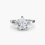 Diamond ring with a pear-shaped center stone and baguette side stones on a white background