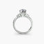 White gold engagement ring with two side diamonds on a white background