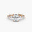 Rose gold ring with a radiant cut diamond on a white background