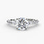 Round diamond ring with a side diamonds white gold on a white background