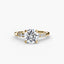 Gold ring with a large round diamond brilliant cut and smaller diamonds on the band against a white background