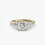 Gold ring with a large princess cut diamond and smaller diamonds on the sides against a white background