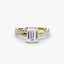 Gold ring with emerald-cut diamond and smaller diamonds on a white background