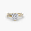 Gold ring with a heart-shaped diamond on a white background
