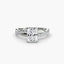 Twisted engagement ring with a radiant cut diamond and micro pave setting on the shank white gold on the white background