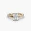 Diamond twisted ring with a radiant-cut center stone and micro pave setting on the shank yellow gold on a white background