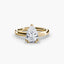 Gold solitaire engagement ring with a pear-shaped diamond on a white background