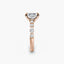 Rose gold ring with a diamond on a white background
