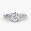 Oval diamond ring with a side stones on white background