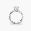 Diamond ring with a triangular cut stone on a white background