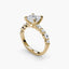 Gold ring with a central diamond and smaller diamonds on a white background