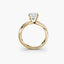 Gold ring with a diamond on a white background