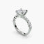 Diamond ring with a central gemstone and smaller stones on a white background