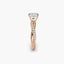 Rose gold ring with a diamond on a white background