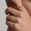 Minimalist curved wedding band in yellow gold