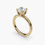 Solaris cushion-cut diamond solitaire engagement ring in 14k yellow gold with an eight-prong tulip-style cathedral setting, viewed from a three-quarter angle against a light gray background.