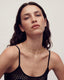Woman wearing a gold initial A lab diamond necklace 