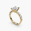 Gold ring with a large diamond and smaller diamonds on a white background