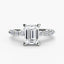 Diamond ring with emerald-cut center stone and smaller diamonds on a white background