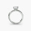 Side view of The Sylvene showing emerald cut diamond ring in balanced double prong white gold setting