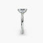 Profile view of The Sylvene showing emerald cut diamond ring in balanced double prong platinum setting