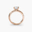 Side view of The Sylvene showing emerald cut diamond ring in balanced double prong rose gold setting