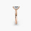 Profile view of The Sylvene showing emerald cut diamond ring in balanced double prong rose gold setting