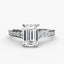 Diamond ring with emerald-cut center stone and smaller diamonds on a white background
