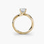 Gold ring with a diamond on a white background