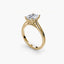 Solitaire gold ring with a emerald cut diamond on a white background