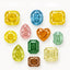 Collection of various colored diamonds on a white background