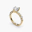 Gold ring with a large diamond and smaller diamonds on a white background