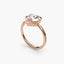 Heart-shaped diamond bezel ring with rose gold solitaire setting 