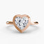Heart-shaped diamond bezel ring with rose gold solitaire setting 