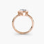 Heart-shaped diamond bezel ring with rose gold solitaire setting 