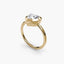 Heart-shaped diamond bezel ring with yellow gold solitaire setting 