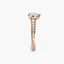 Rose gold ring with diamonds on a white background