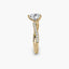 Gold ring with a heart-shaped diamond on a white background