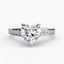 Diamond ring with a heart-shaped center stone on a white background