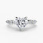 Heart-shaped diamond ring on a white background