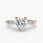 Heart-shaped diamond ring with rose gold setting on a white background