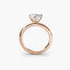 Side view of The Kaelis showing heart cut diamond in three-prong rose gold solitaire setting 